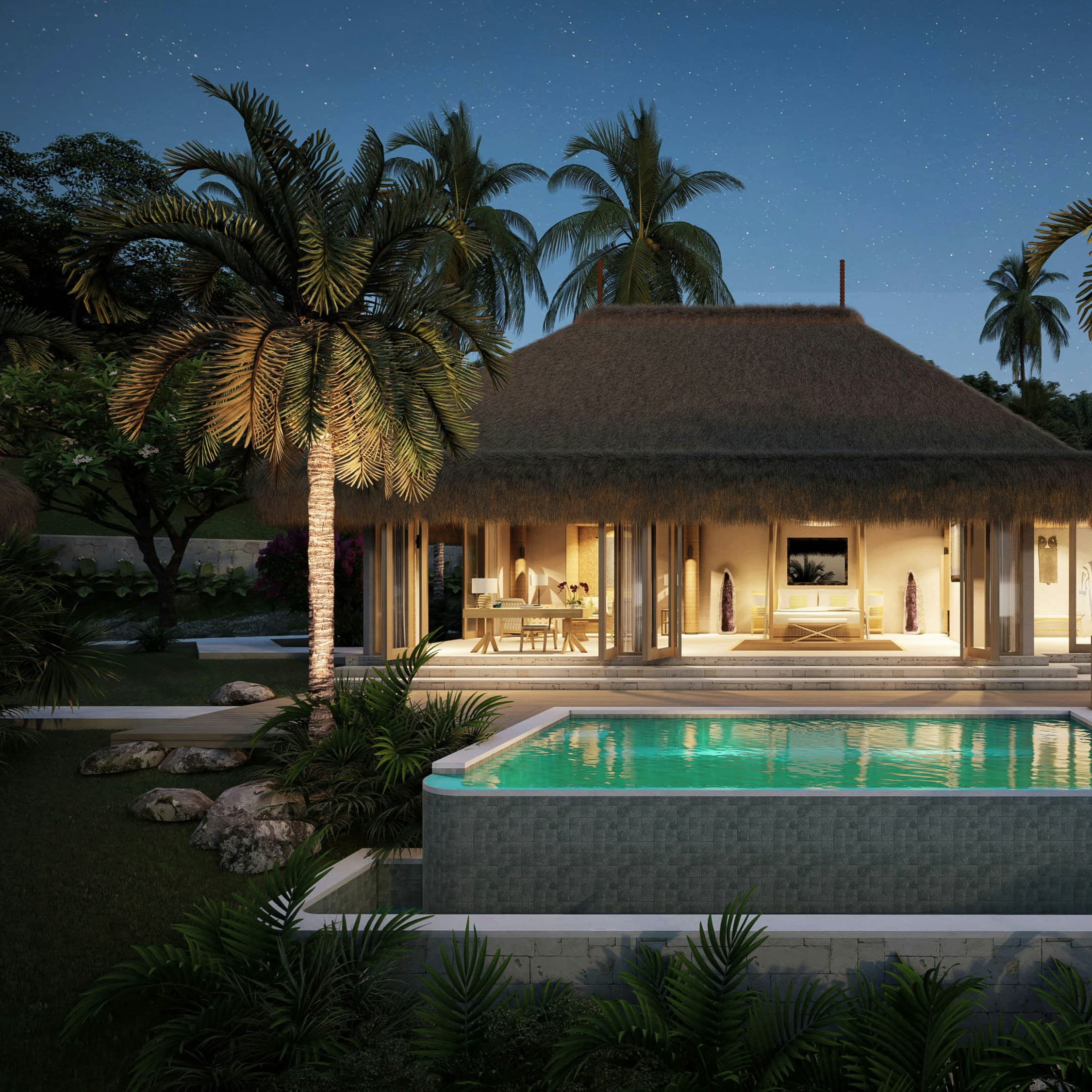 A tropical villa with an illuminated pool glowing at twilight